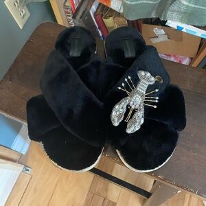 Laines London black cross slippers with gold tone and Pearl tone lobster brooch